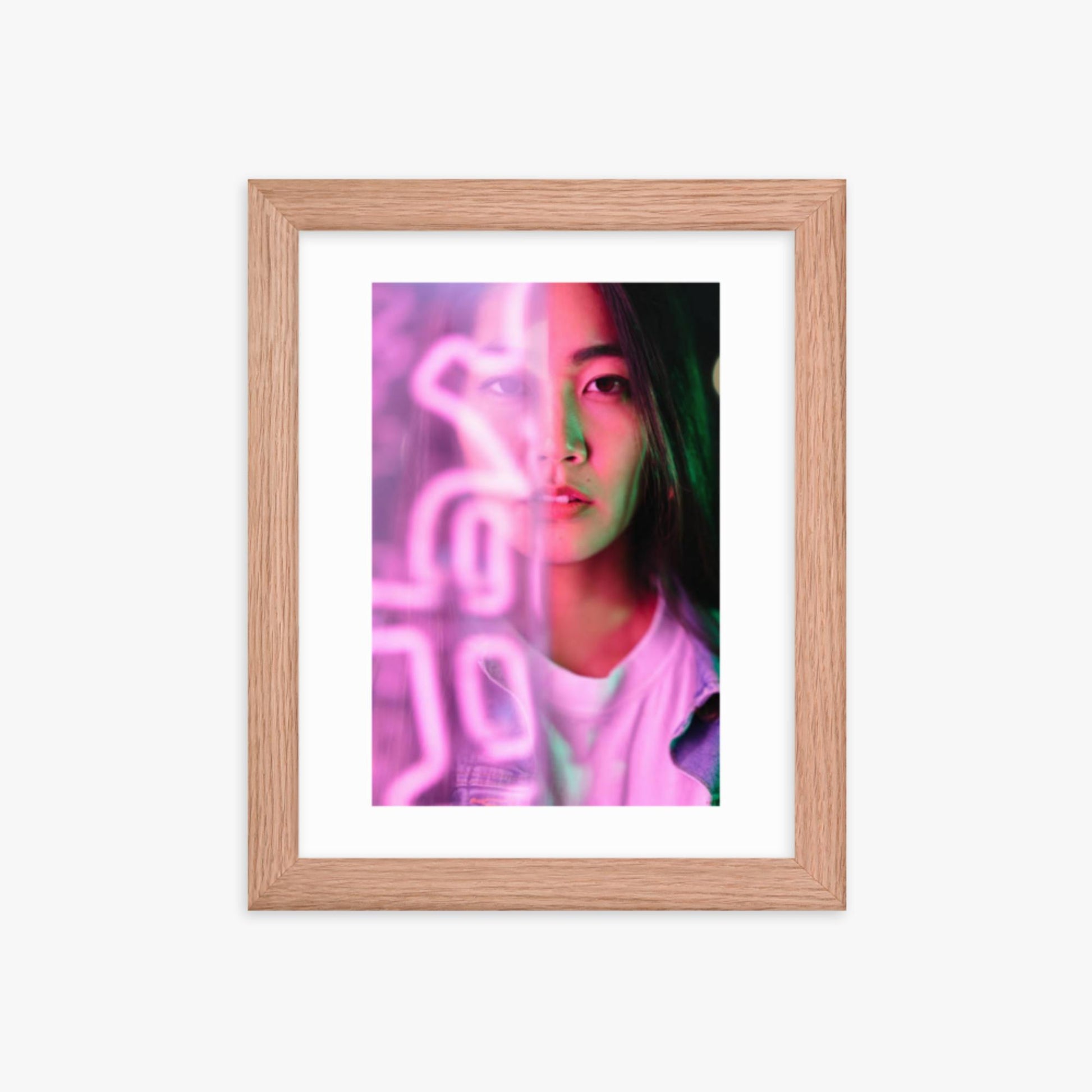 Portrait of young woman lit by pink neon light 8x10 in Poster With Oak Frame