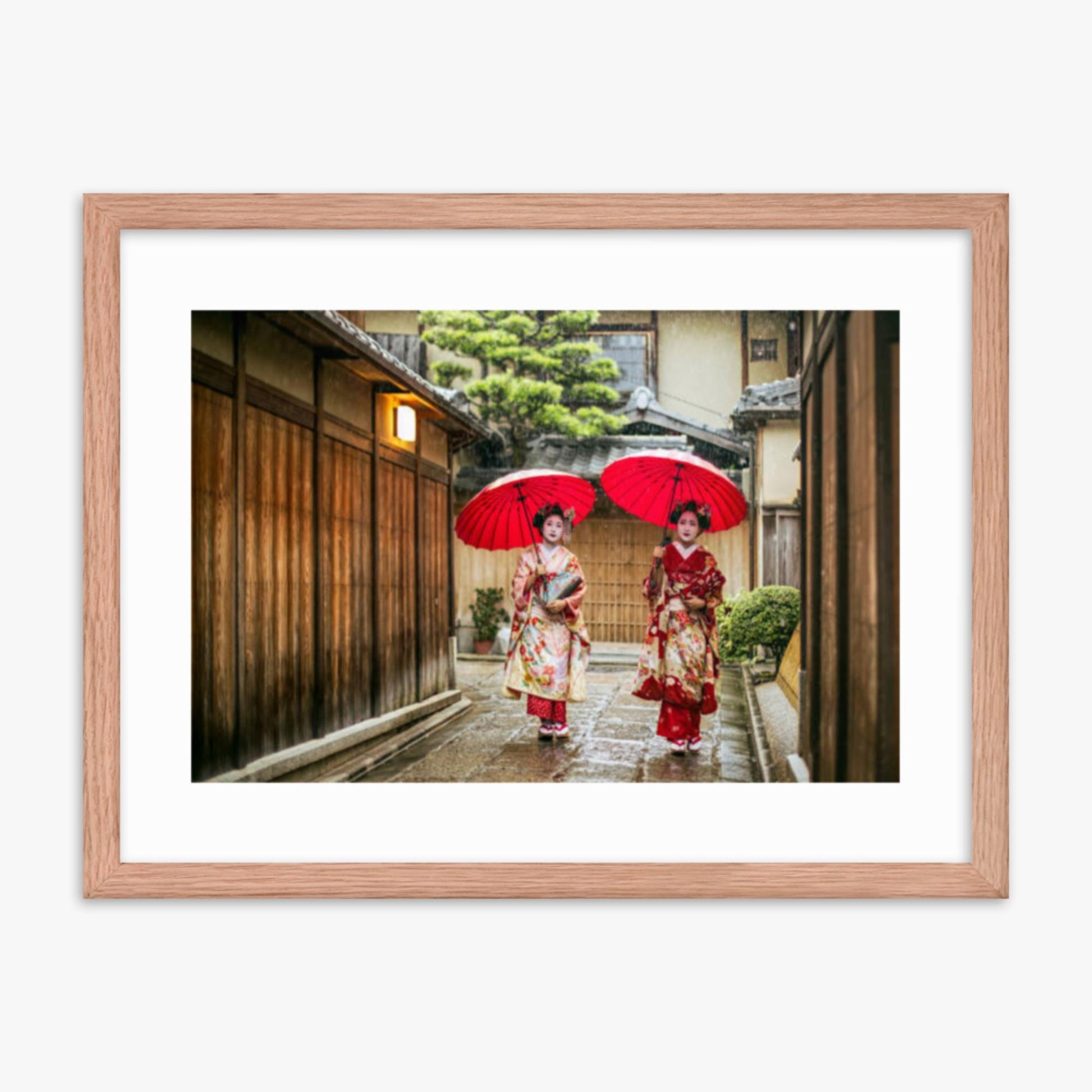 Geishas holding red umbrellas during rainy season 18x24 in Poster With Oak Frame