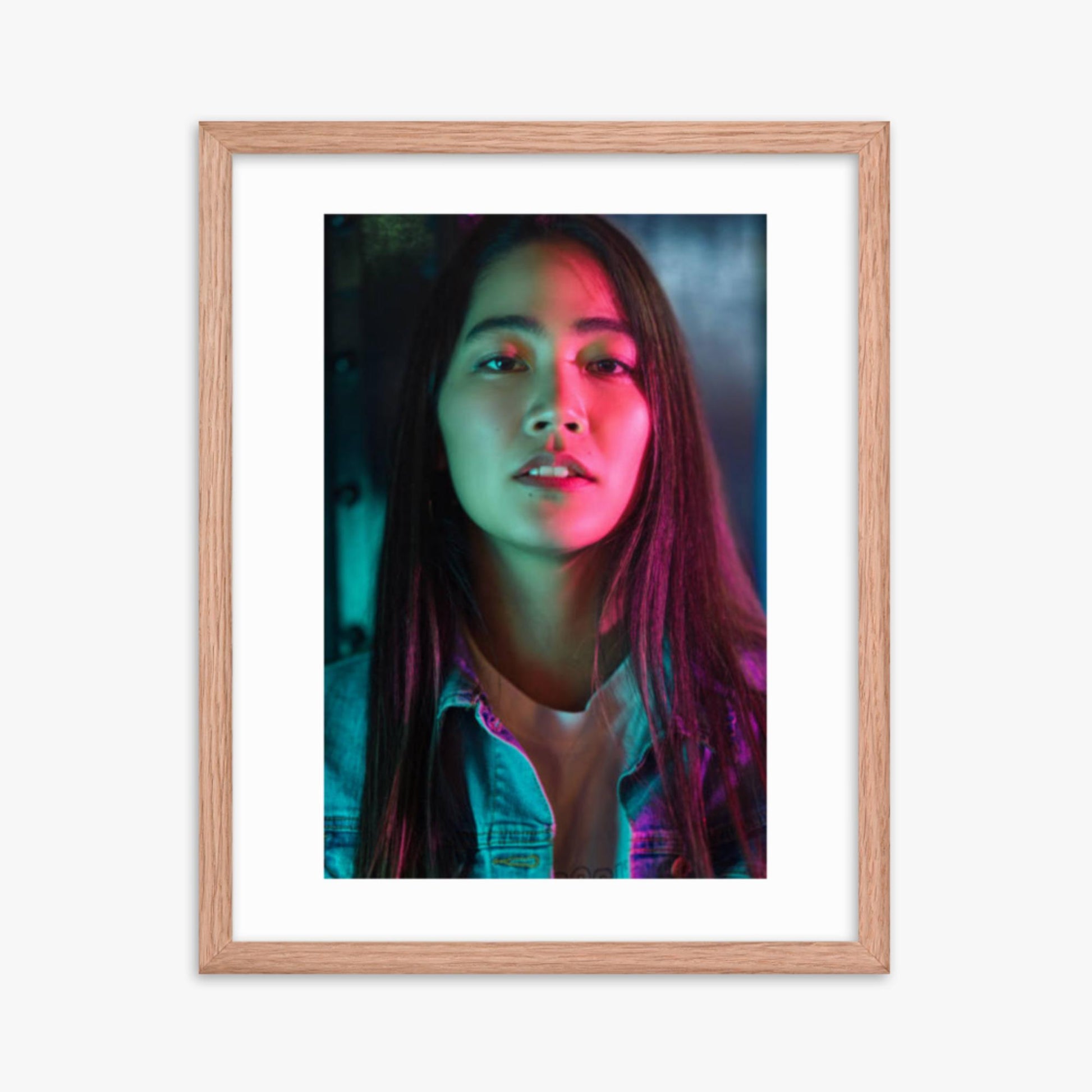 Portrait of young woman lit by colorful neon lights at night 16x20 in Poster With Oak Frame