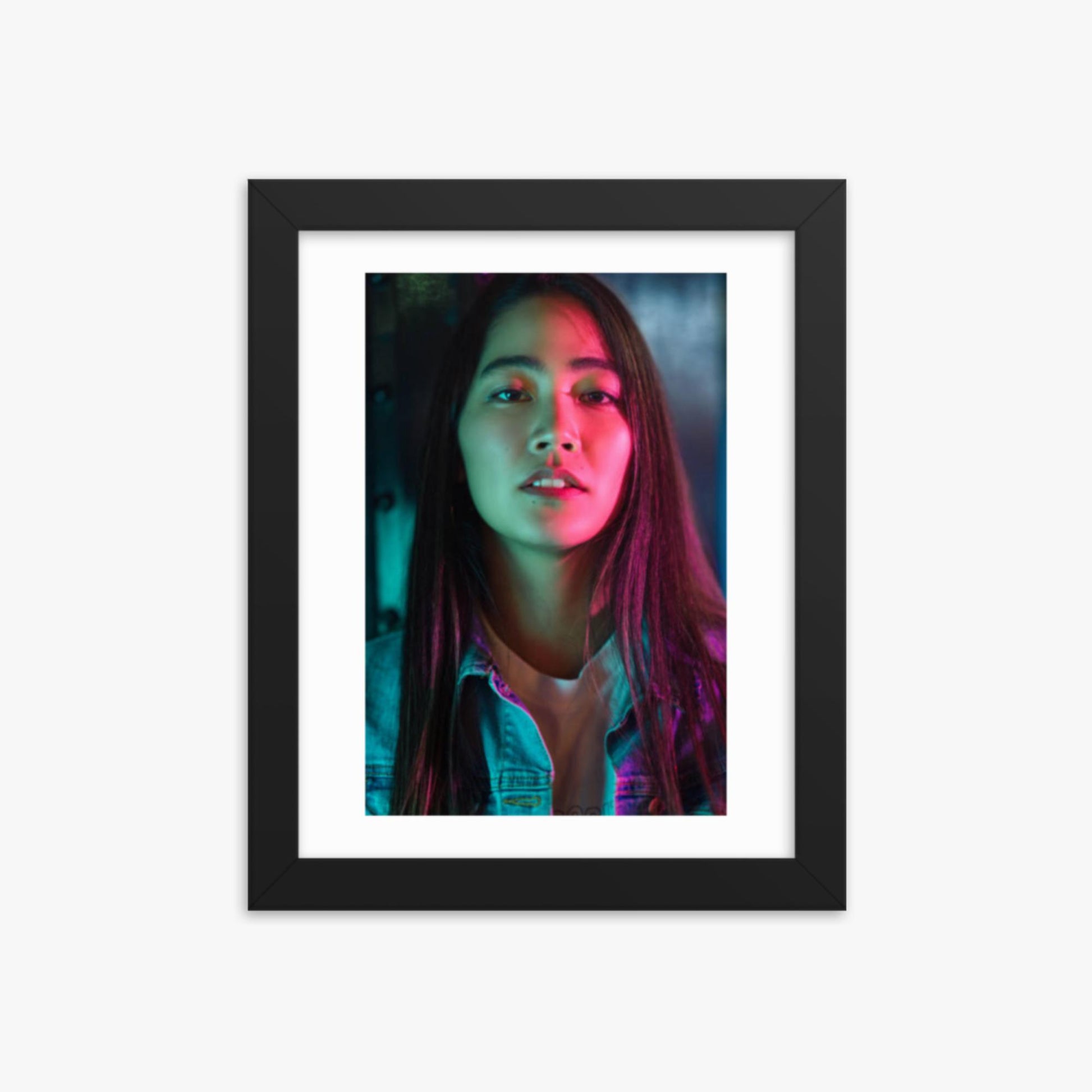 Portrait of young woman lit by colorful neon lights at night 8x10 in Poster With Black Frame