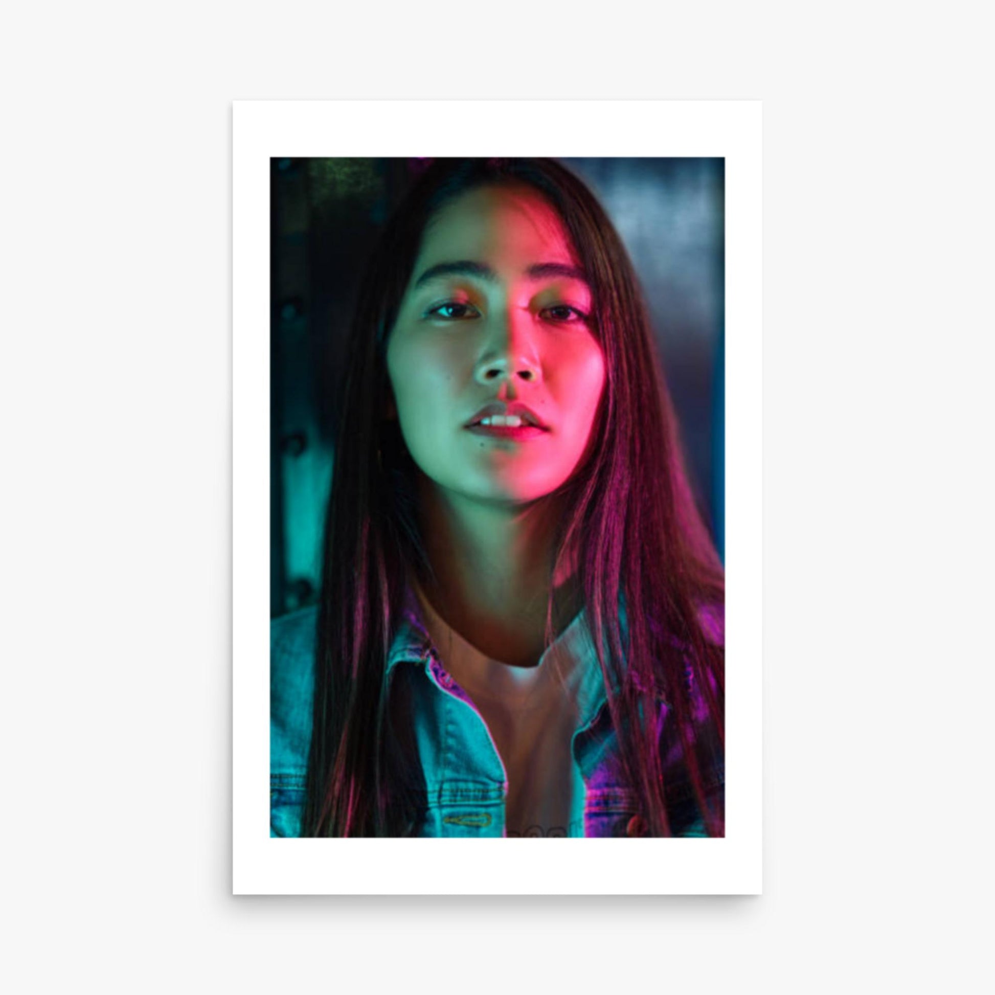 Portrait of young woman lit by colorful neon lights at night 24x36 in Poster