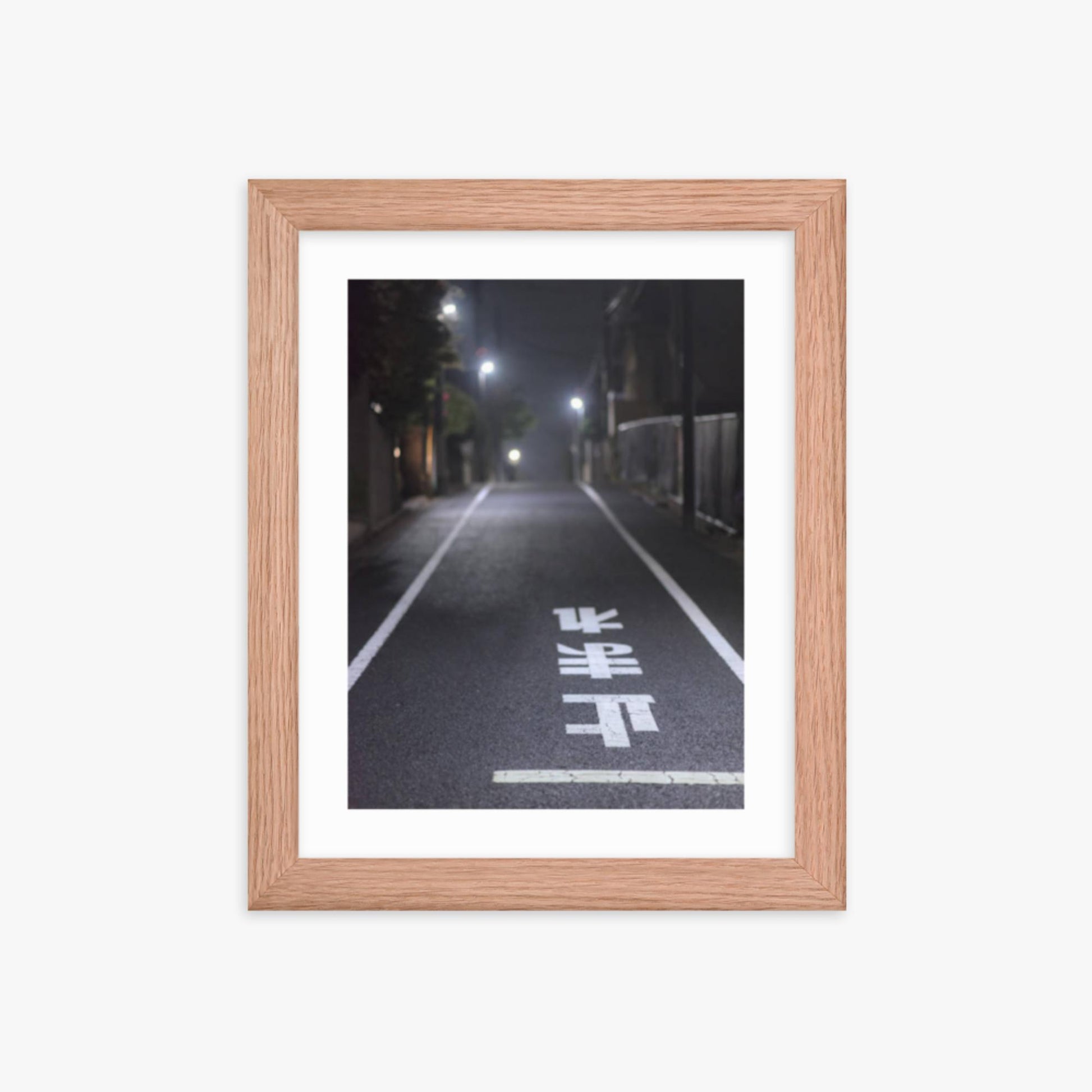 Typical road by night with the stop sign in Japanese written on the ground 8x10 in Poster With Oak Frame